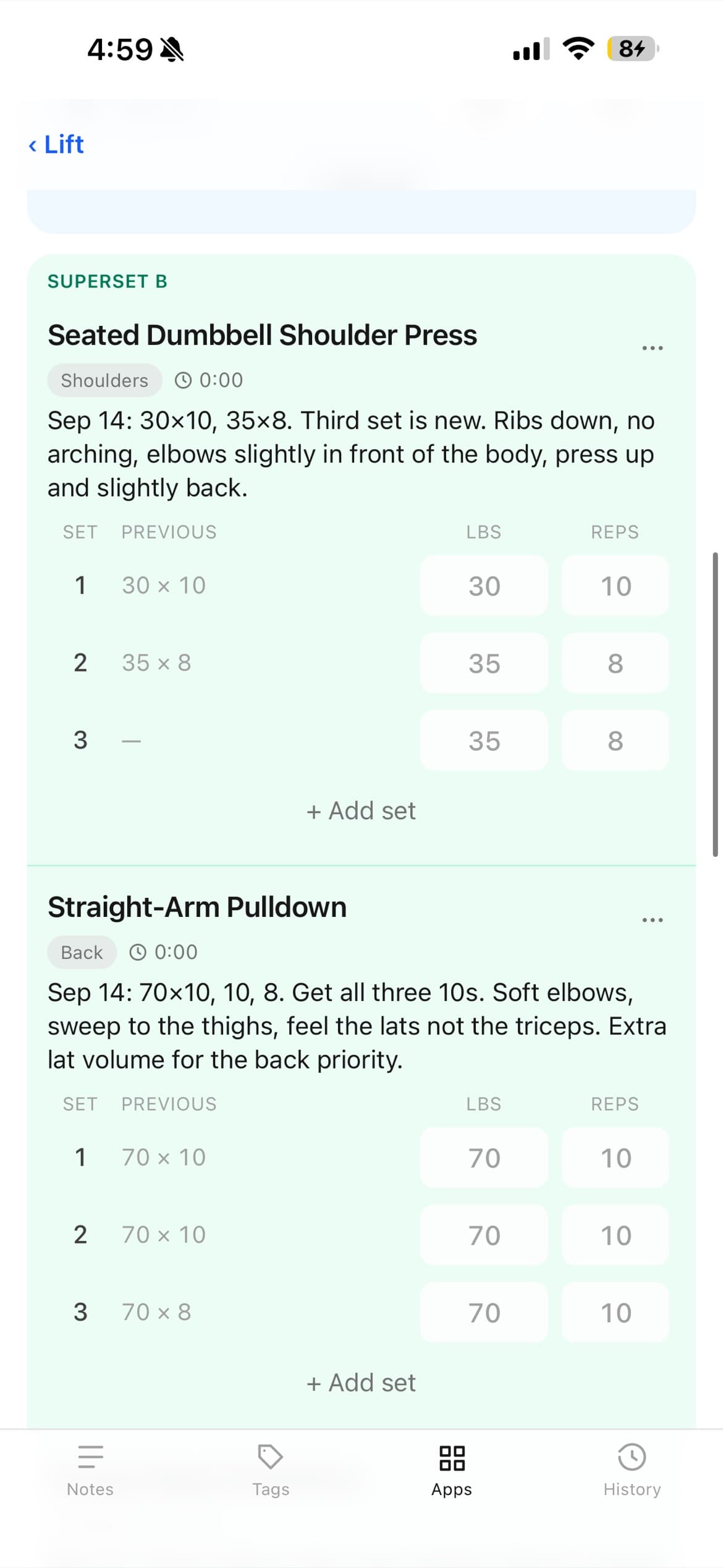 Superset B tinted green: Seated Dumbbell Shoulder Press and Straight-Arm Pulldown, each with last session's numbers and a note on form.